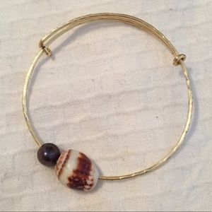Gold sea shell and pearl bangle